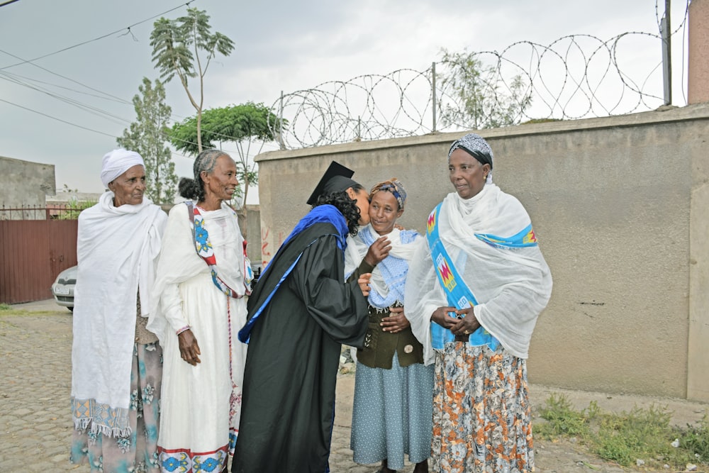 a group of women standing next to each other