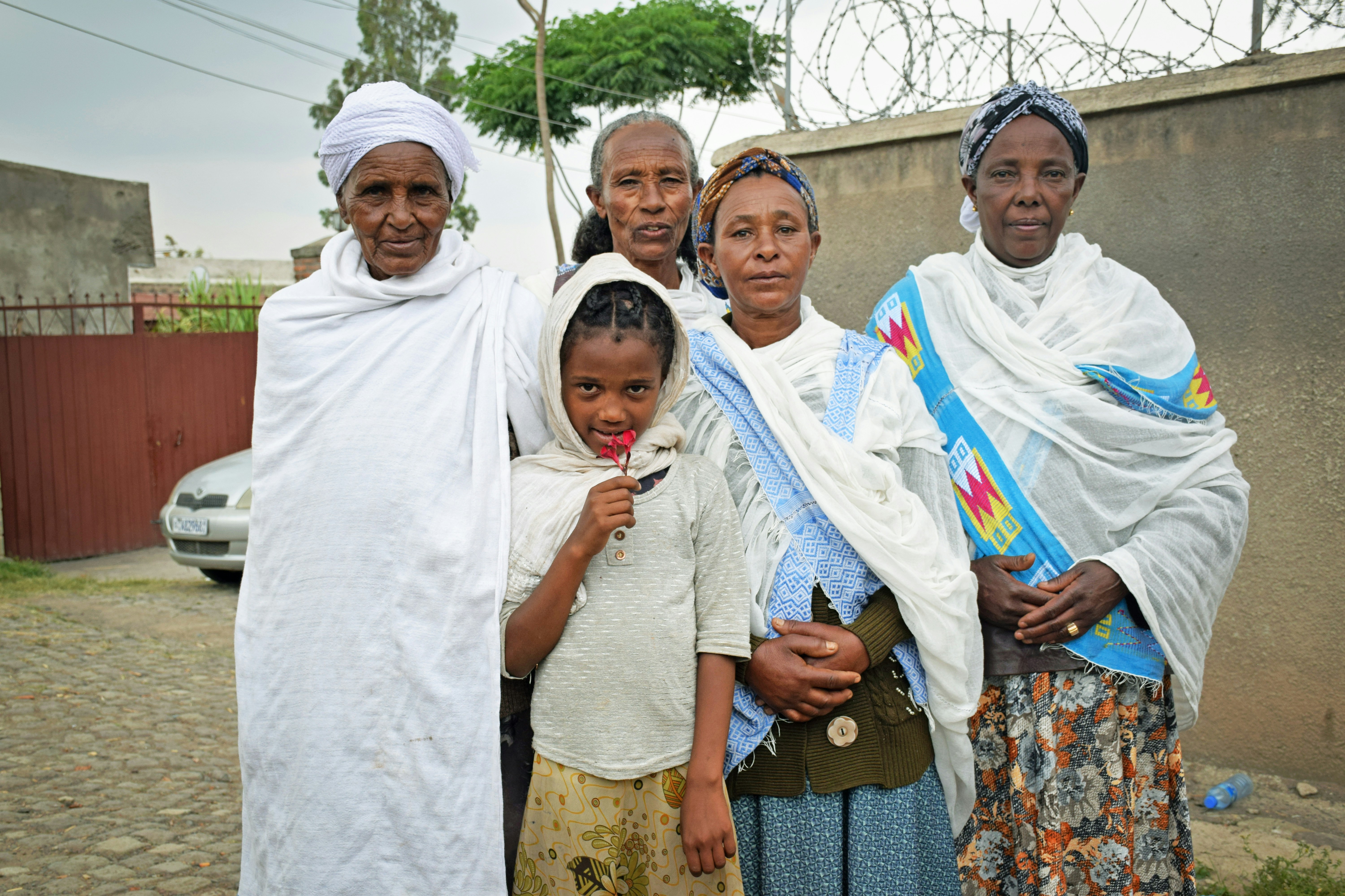 a group of women standing next to each other