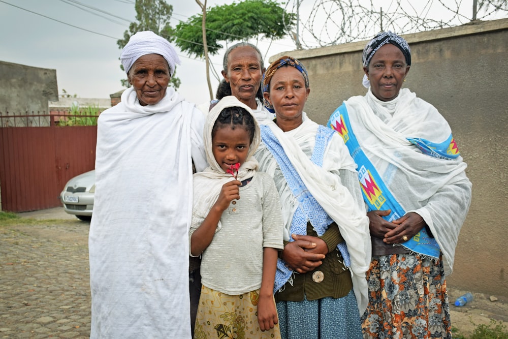 a group of women standing next to each other