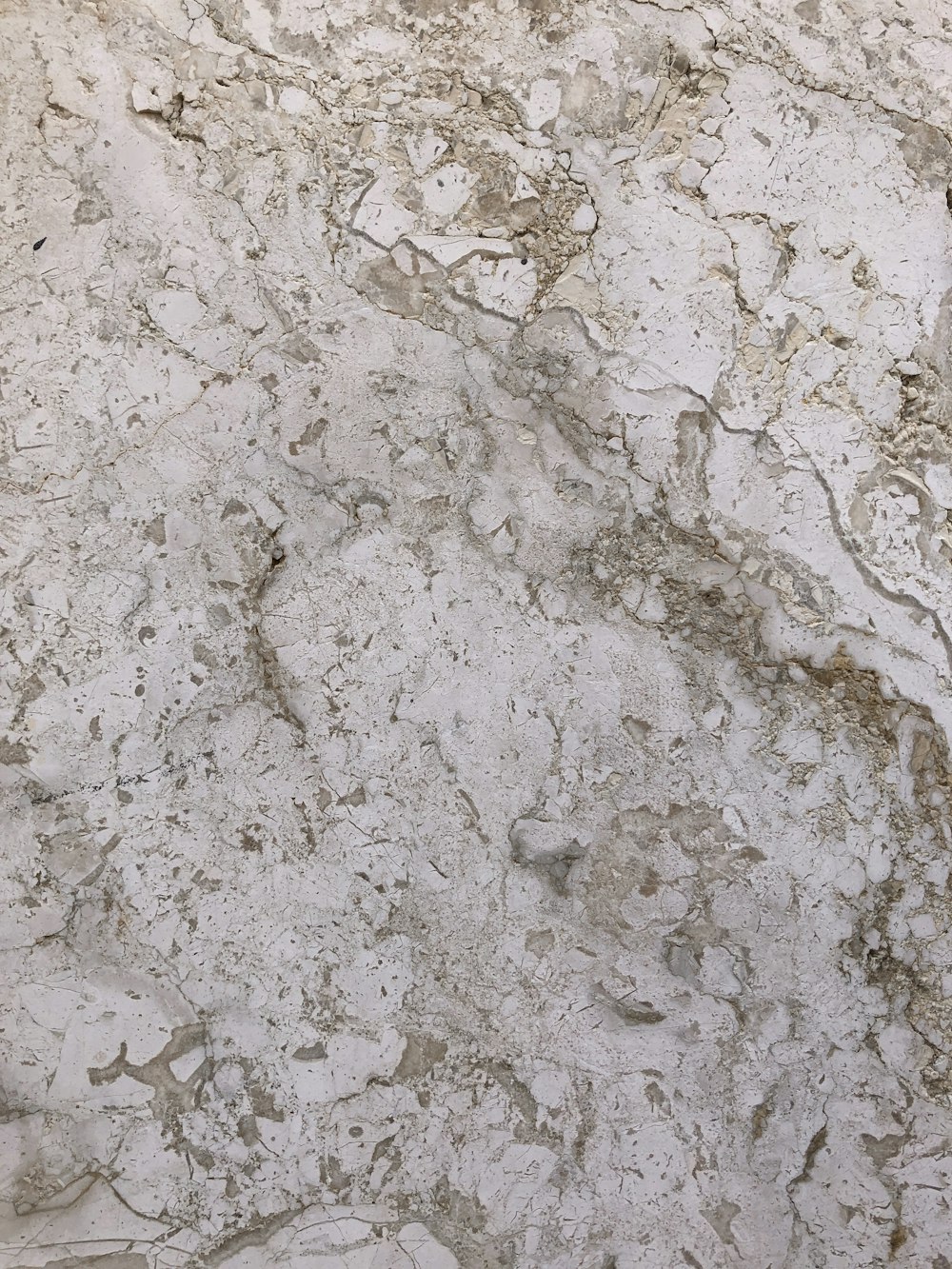a close up of a white marble counter top