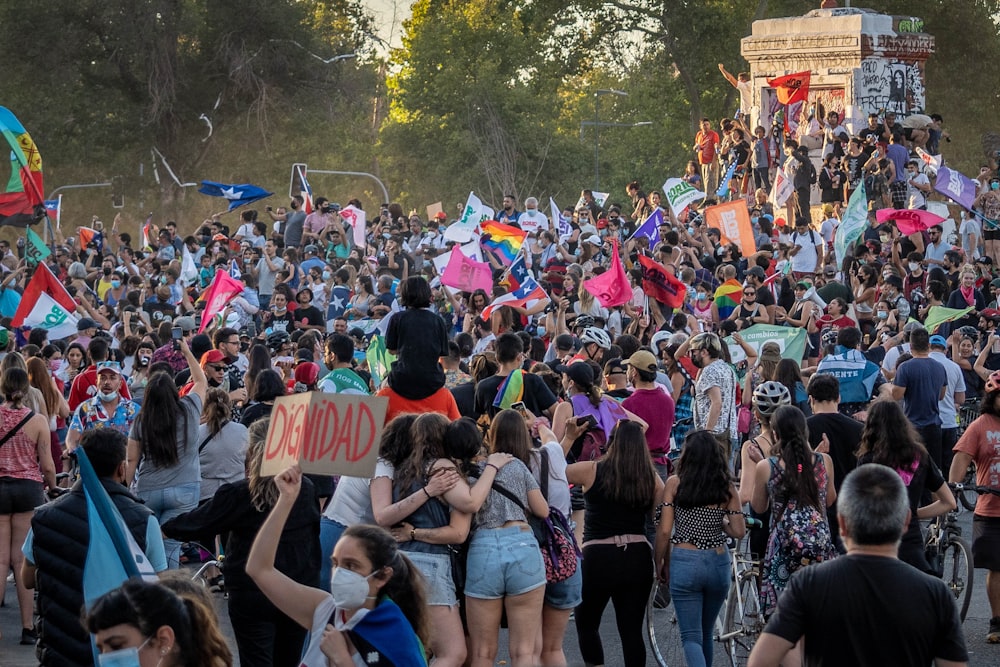 a large group of people standing around each other