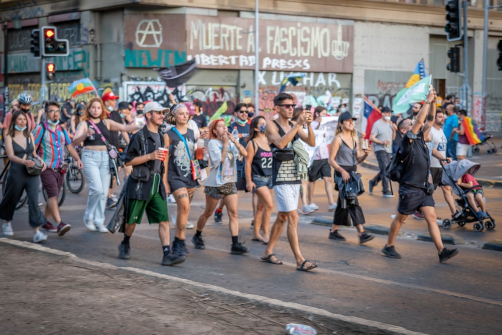 a group of people walking down a street