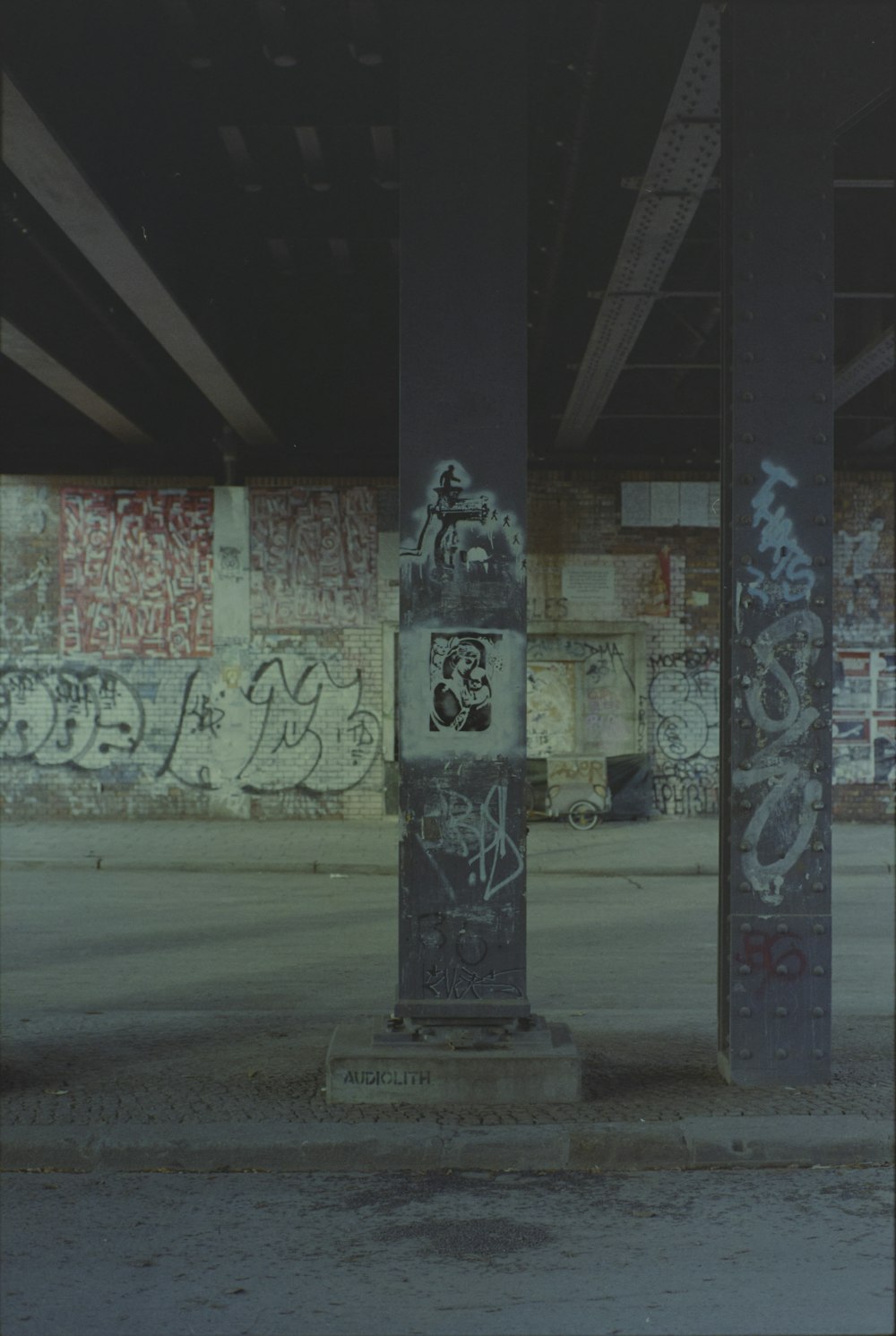 a parking garage with graffiti all over the walls