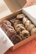 a box filled with chocolate cookies and cookies
