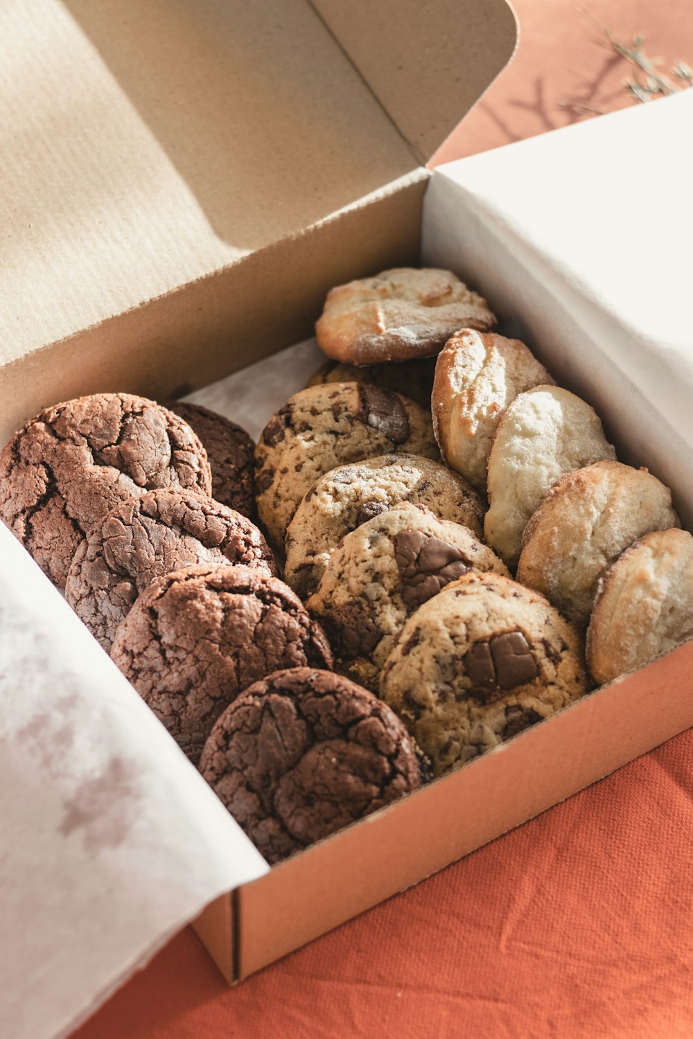 a box filled with chocolate cookies and cookies