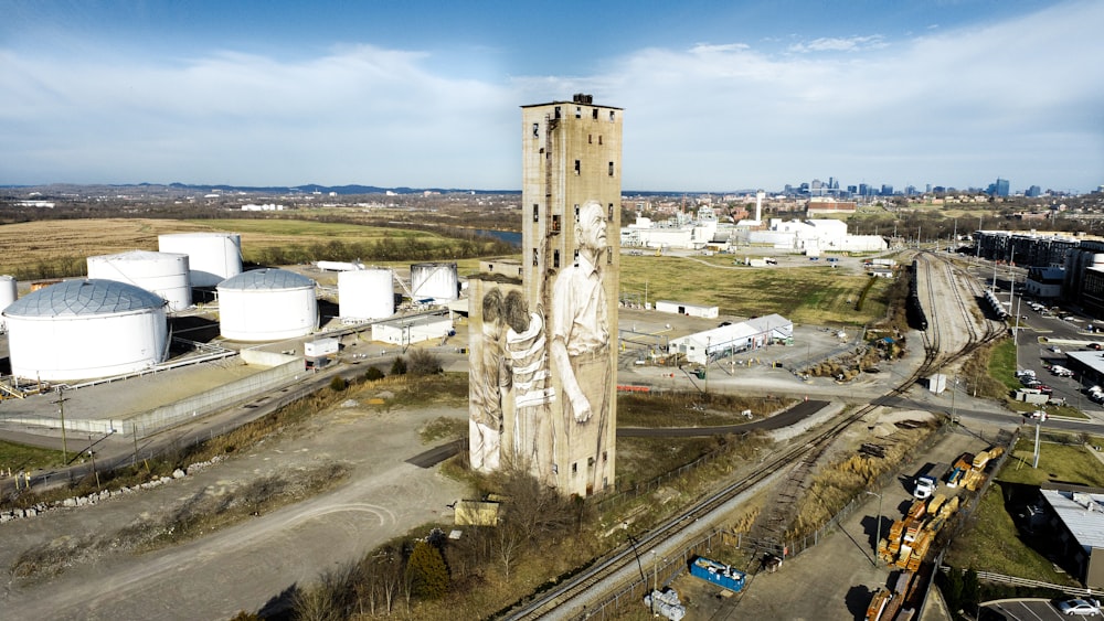 an aerial view of a large building with a statue on it