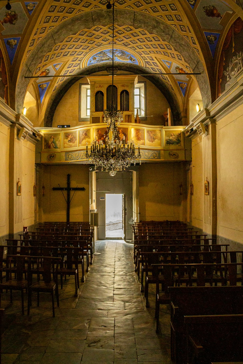 a church with a chandelier hanging from the ceiling