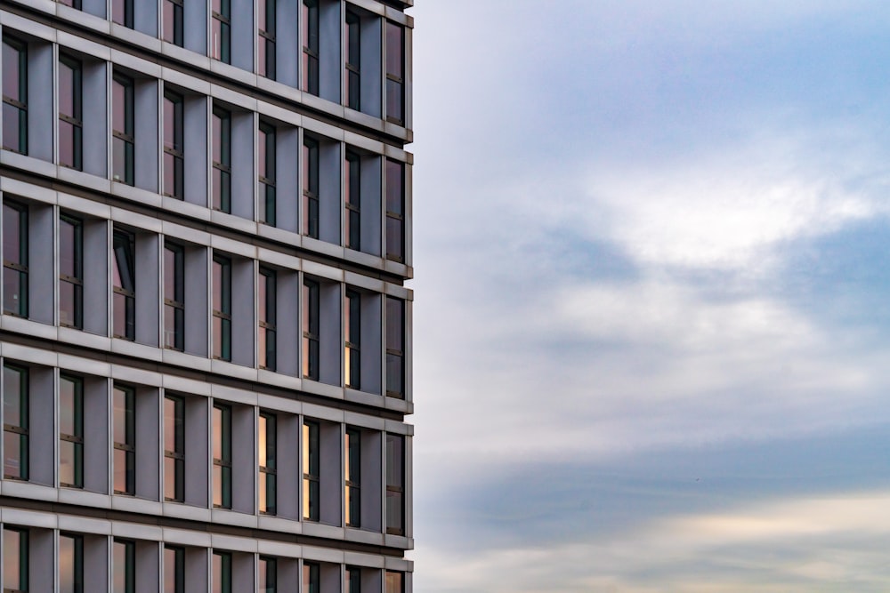 a tall building with many windows on top of it