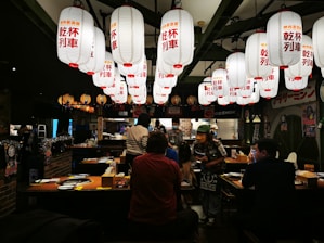 Cozy Vietnamese restaurant interior with colorful lanterns and traditional decorations.