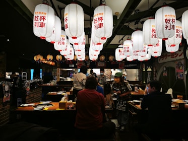 Cozy Vietnamese restaurant interior with colorful lanterns and traditional decorations.