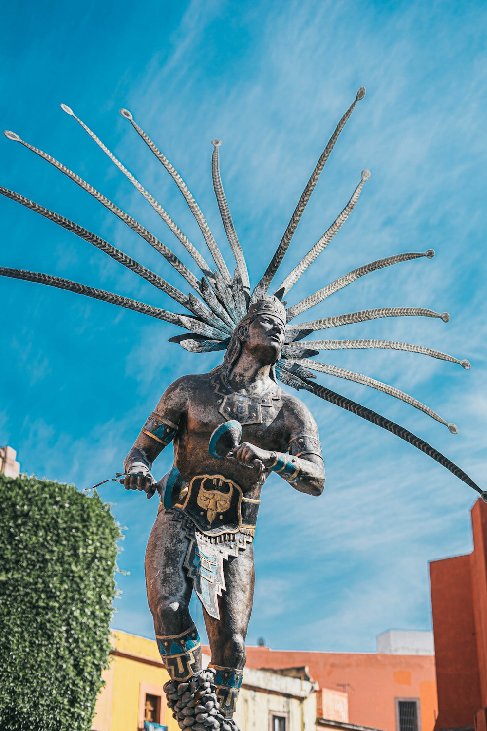 a statue of a man with a large headdress