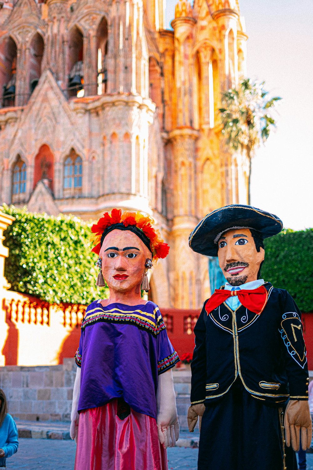 a couple of people that are standing in front of a building