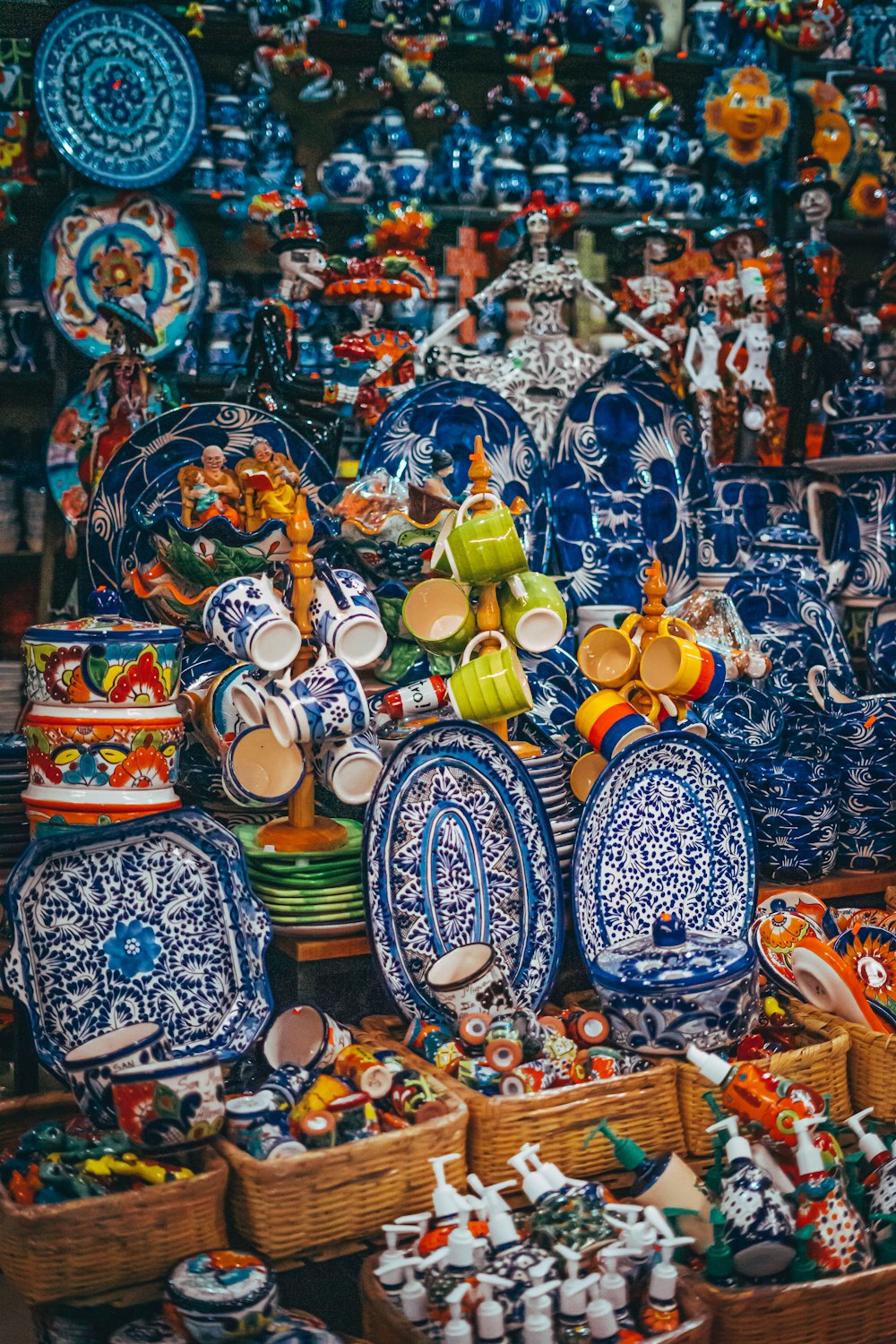 a table topped with lots of blue and white plates