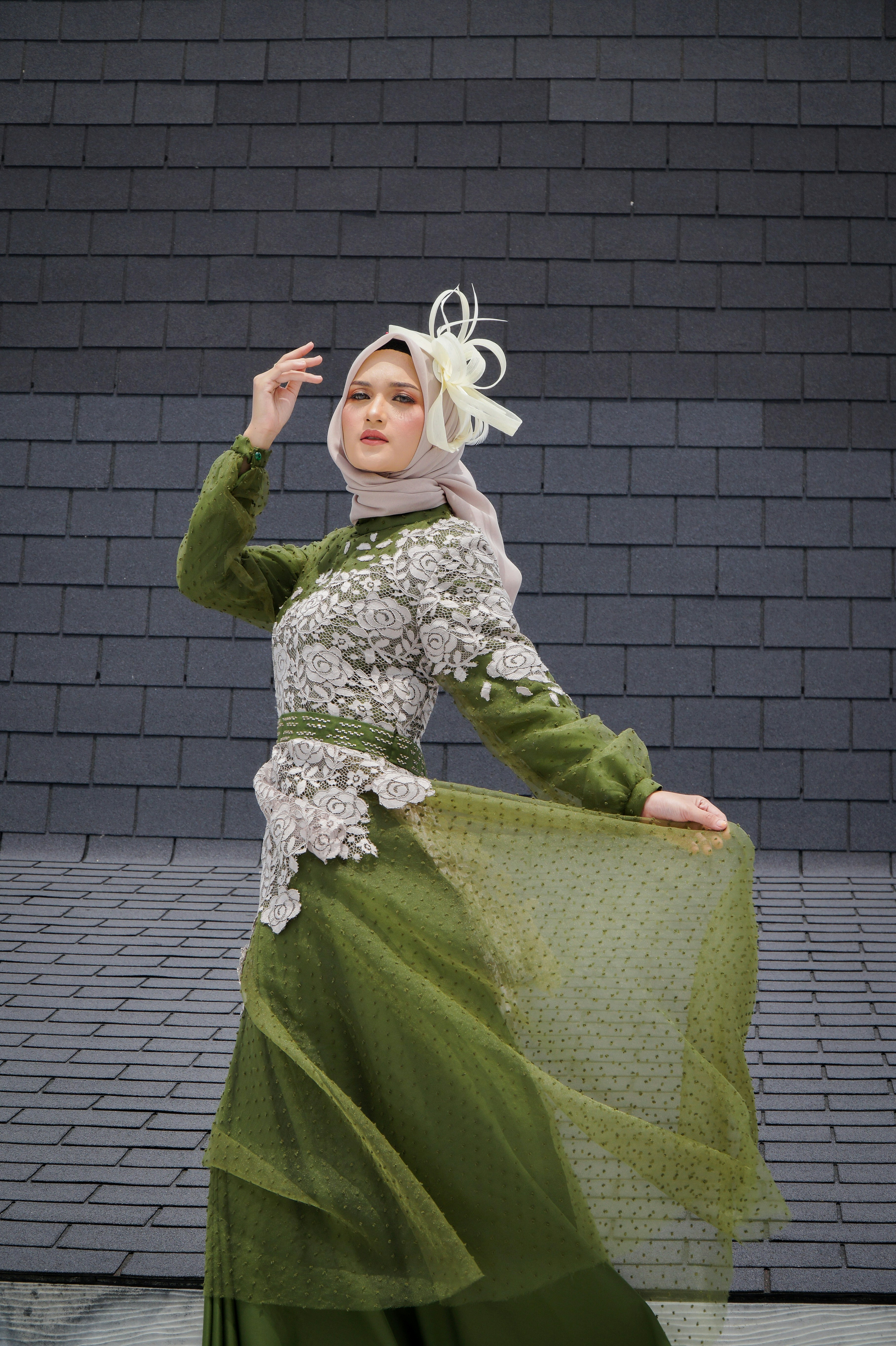 a woman in a green and white dress