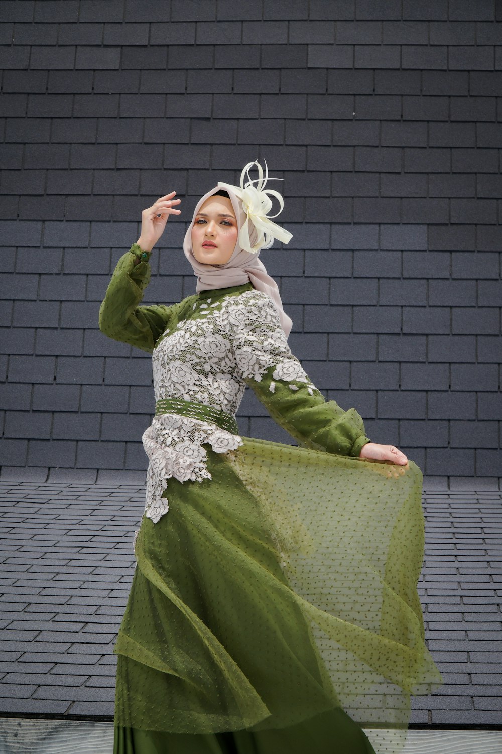 a woman in a green and white dress