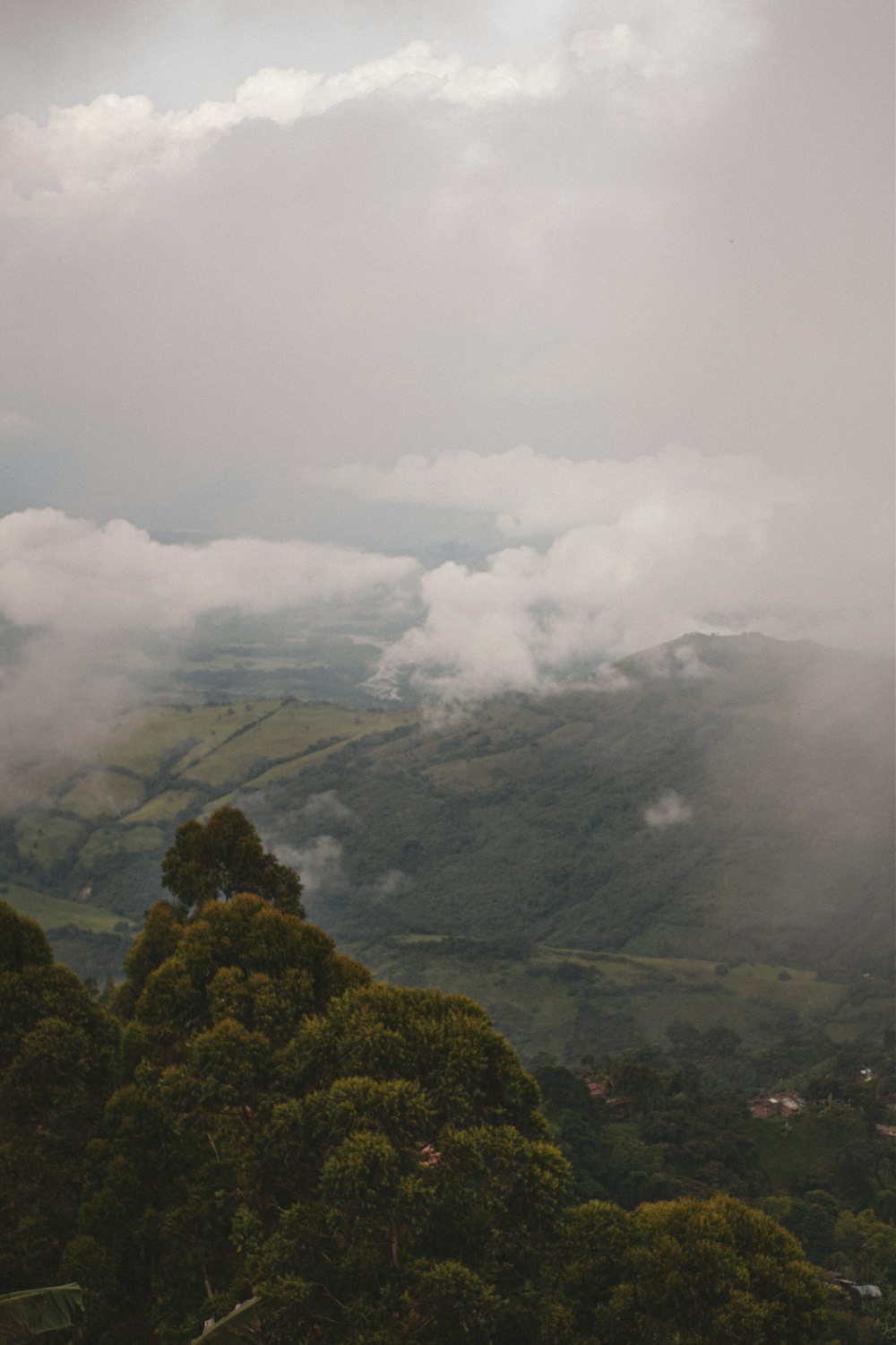 a view of a mountain range with clouds in the sky