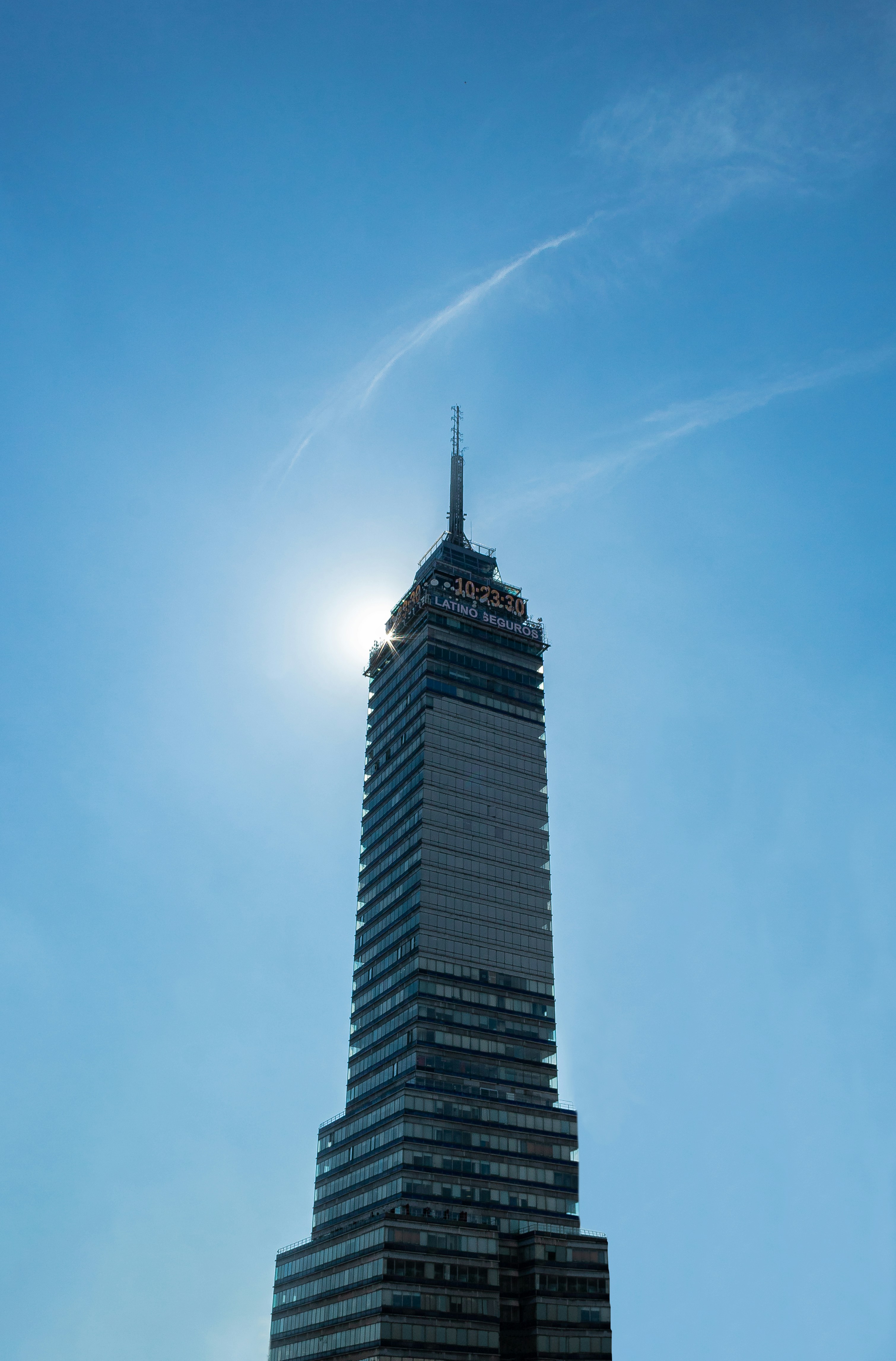 a very tall building with a sky background