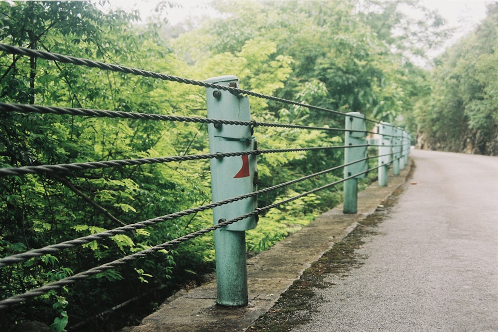 a green fence with a red arrow on it