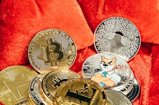 a pile of bitcoins sitting on top of a red blanket