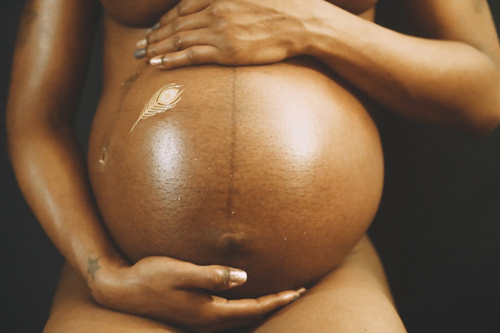 a close up of a pregnant woman's belly