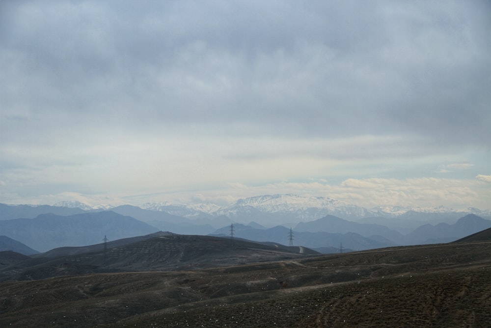 a view of a mountain range with mountains in the background