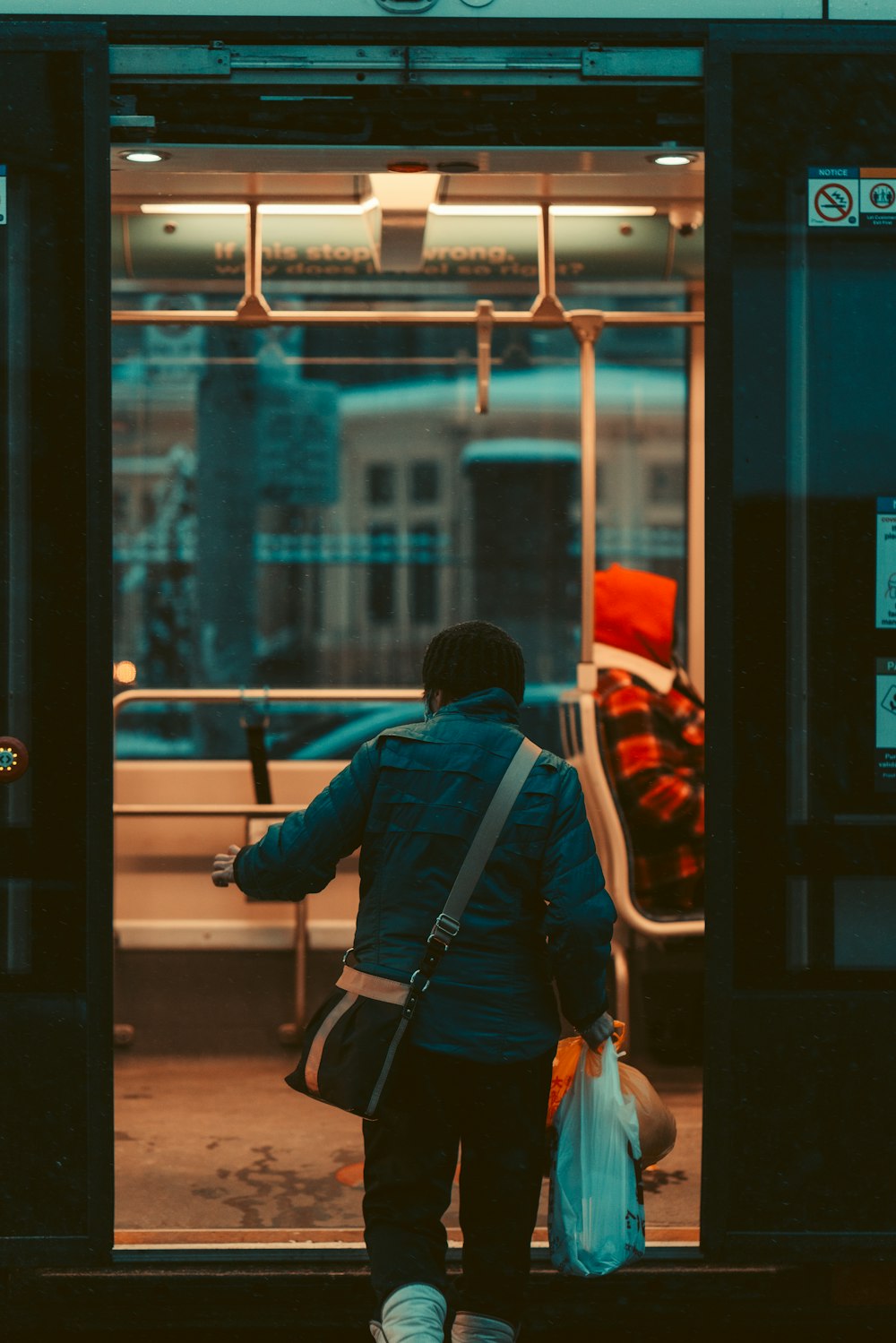 a person walking out of a train door