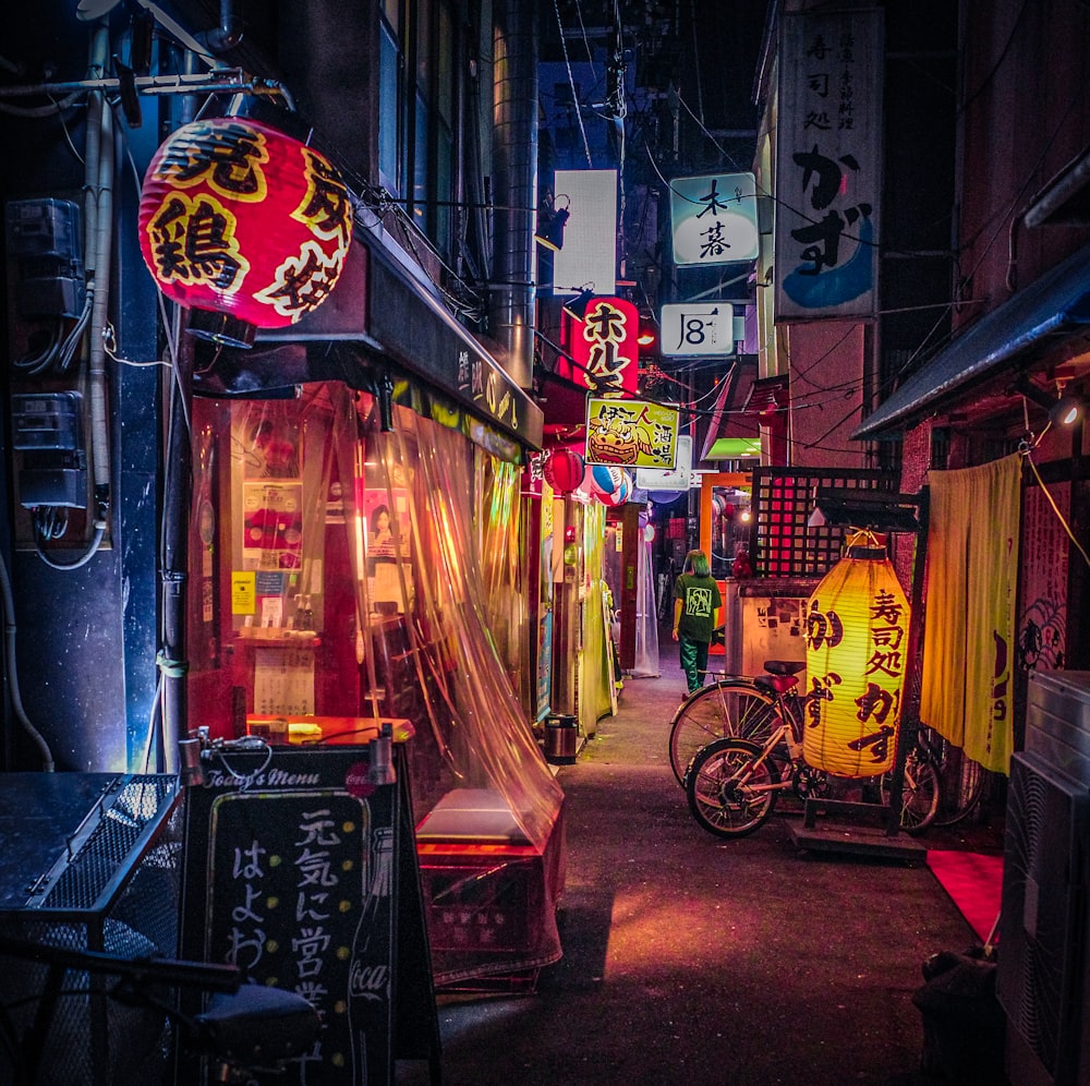 a narrow alley with a bike parked in front of it