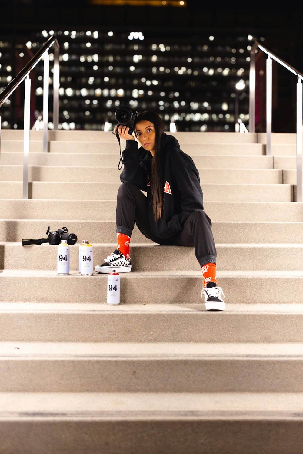 a woman sitting on the steps of a building