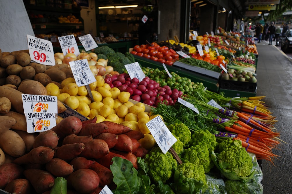 a bunch of fruits and vegetables on display at a market