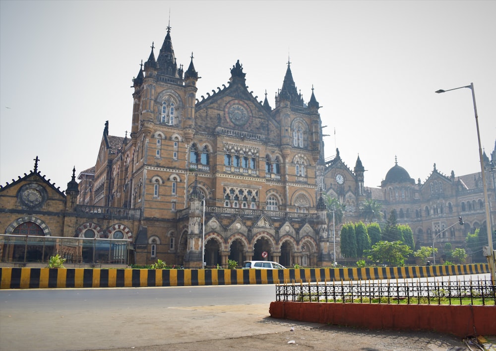 a large building with a clock tower in front of it