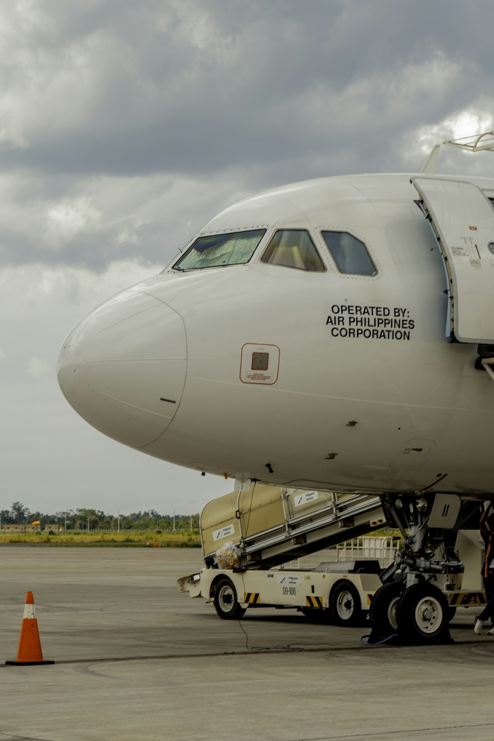 a large jetliner sitting on top of an airport tarmac