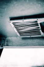 a black and white photo of a ceiling fan