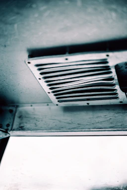a black and white photo of a ceiling fan