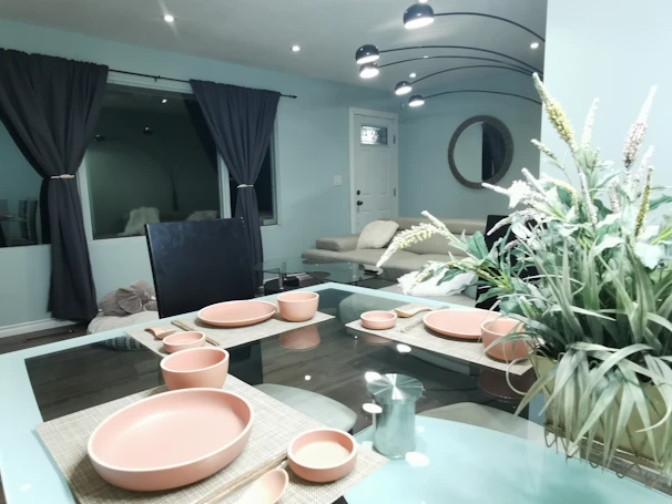 A modern dining room featuring a ritrovo customisable porcelain table set with elegant tableware.