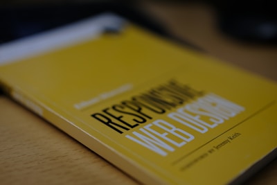 a yellow book sitting on top of a wooden table