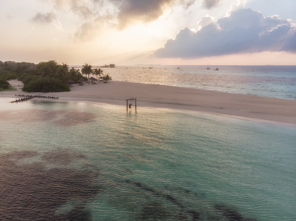 an aerial view of a sandy beach and ocean