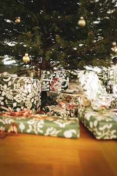 A decorated Christmas tree surrounded by wrapped presents.