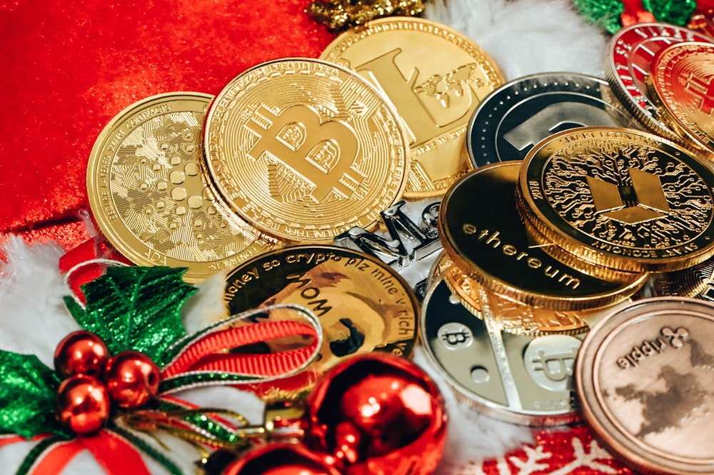a pile of bitcoins sitting on top of a pile of christmas decorations