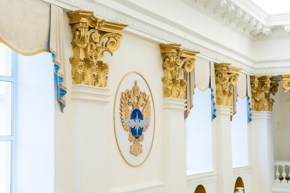 a room with gold and blue decorations on the walls