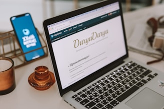 a laptop computer sitting on top of a desk