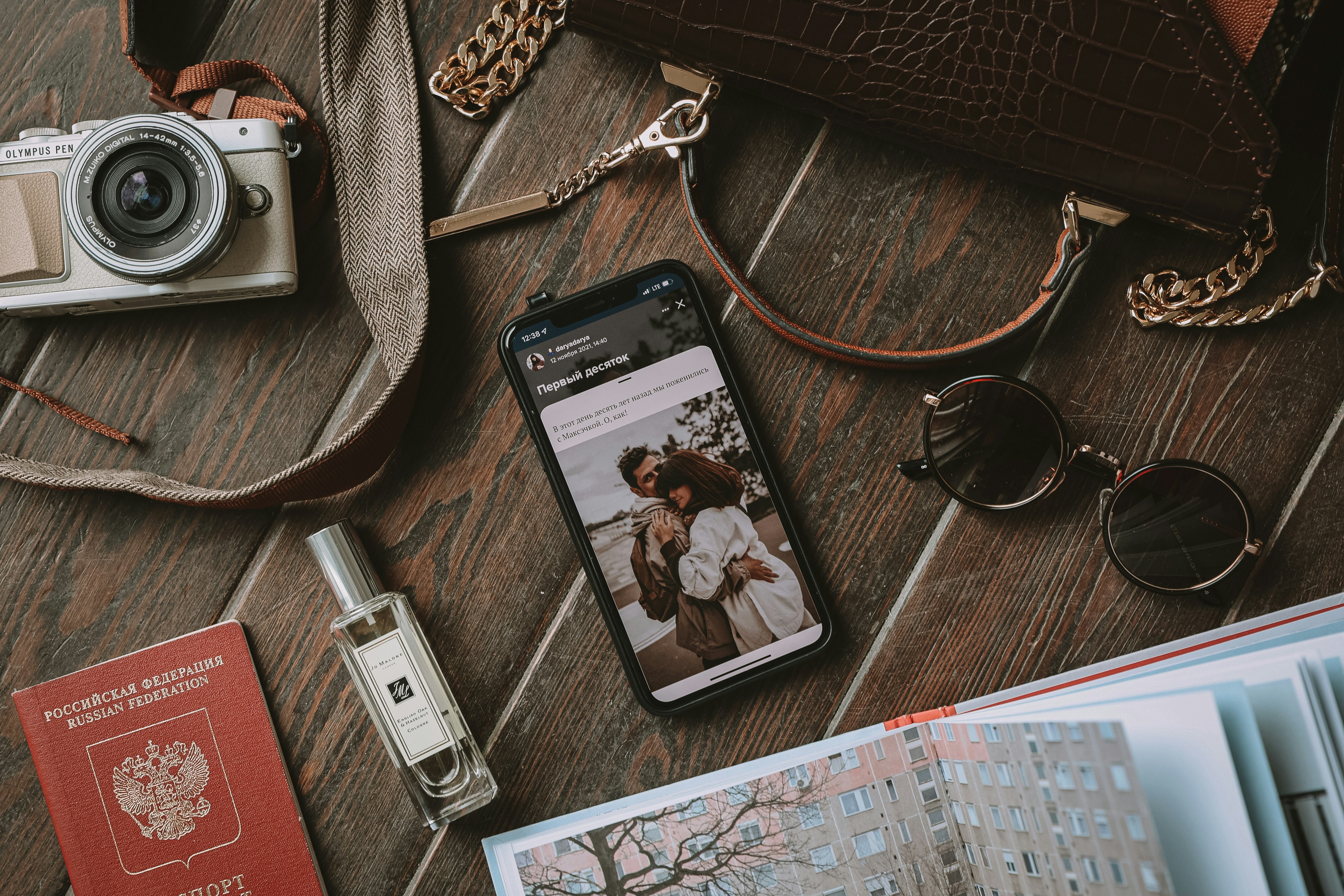 a cell phone sitting on top of a wooden floor, 