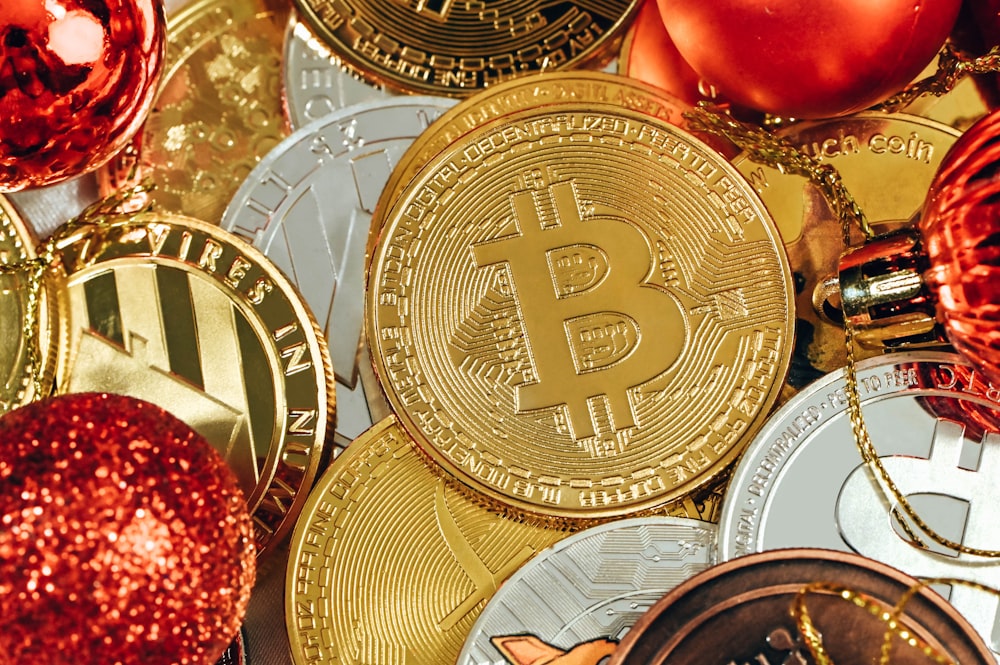 a pile of bitcoins and christmas ornaments