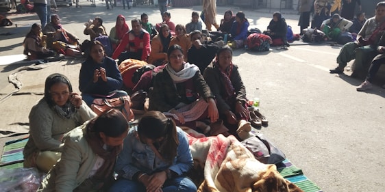 A group of people from Patagonia sharing a warm moment outdoors, symbolizing community support and solidarity.
