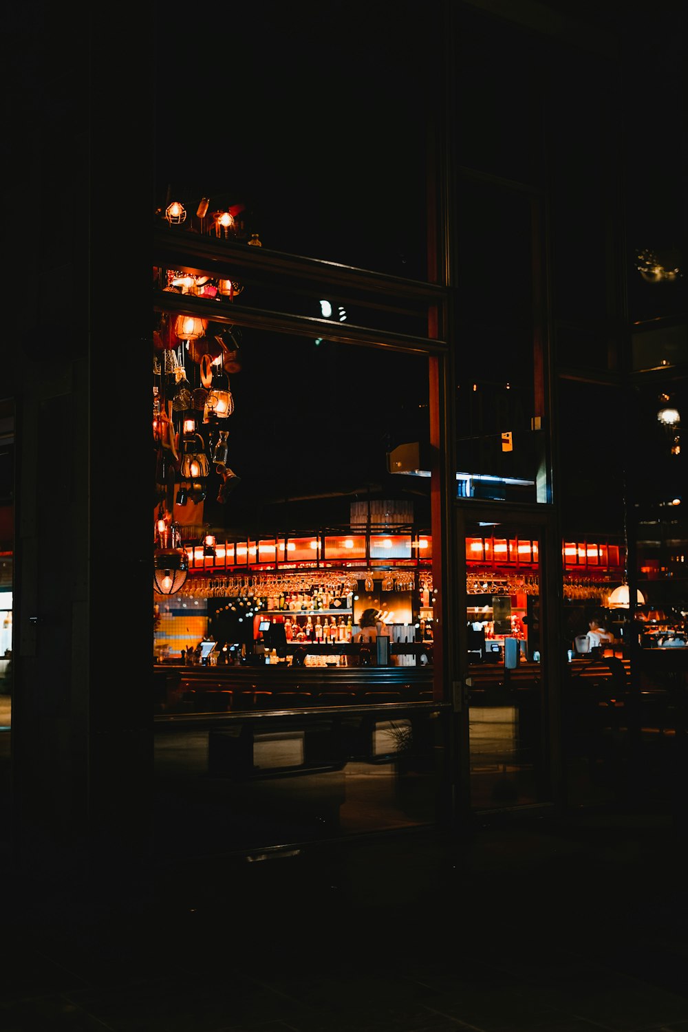 a view of a city at night through a window