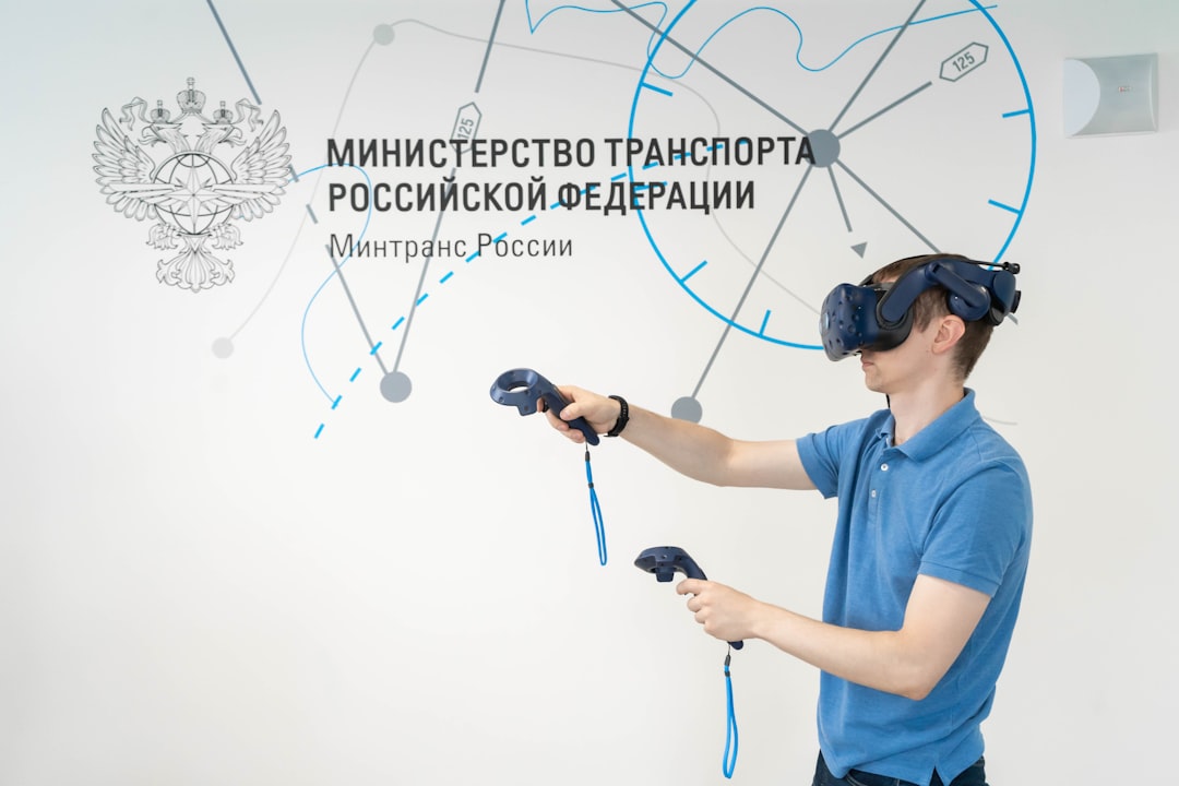 a man in a blue shirt using a pair of virtual glasses, Higher Engineering School of the Russian University of Transport.