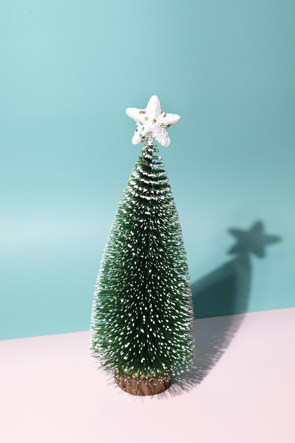 a small christmas tree with a star on top