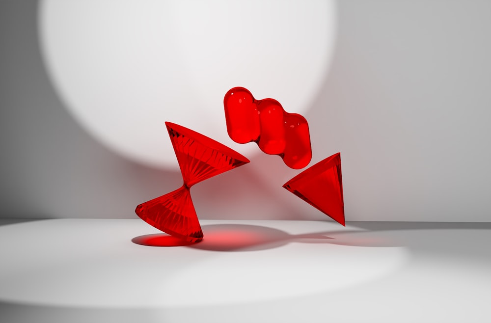 a group of red objects sitting on top of a white floor