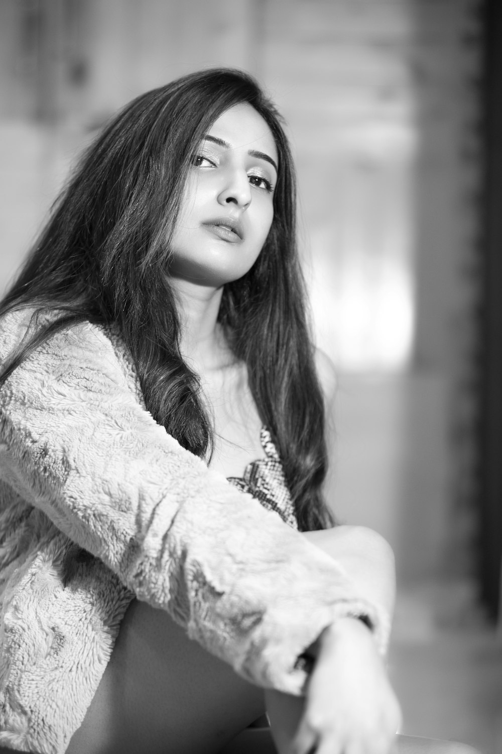 a black and white photo of a woman with long hair