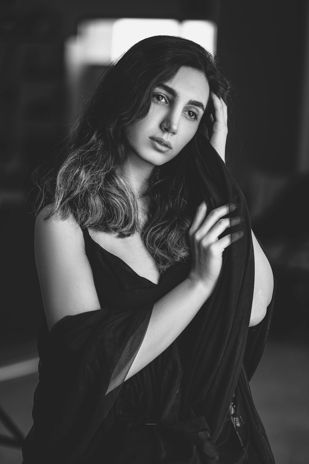 a black and white photo of a woman with long hair