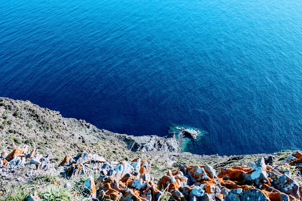 a view of a body of water from the top of a hill